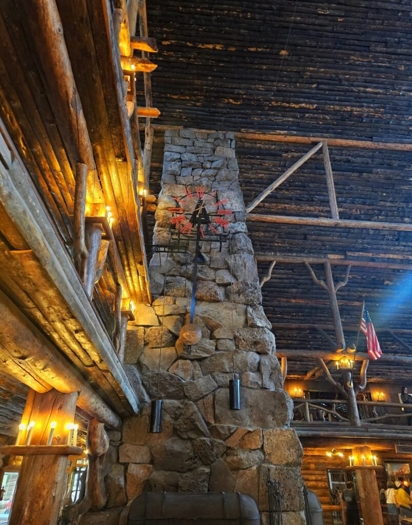 Pendulum clock on the fireplace at Old Faithful Inn.