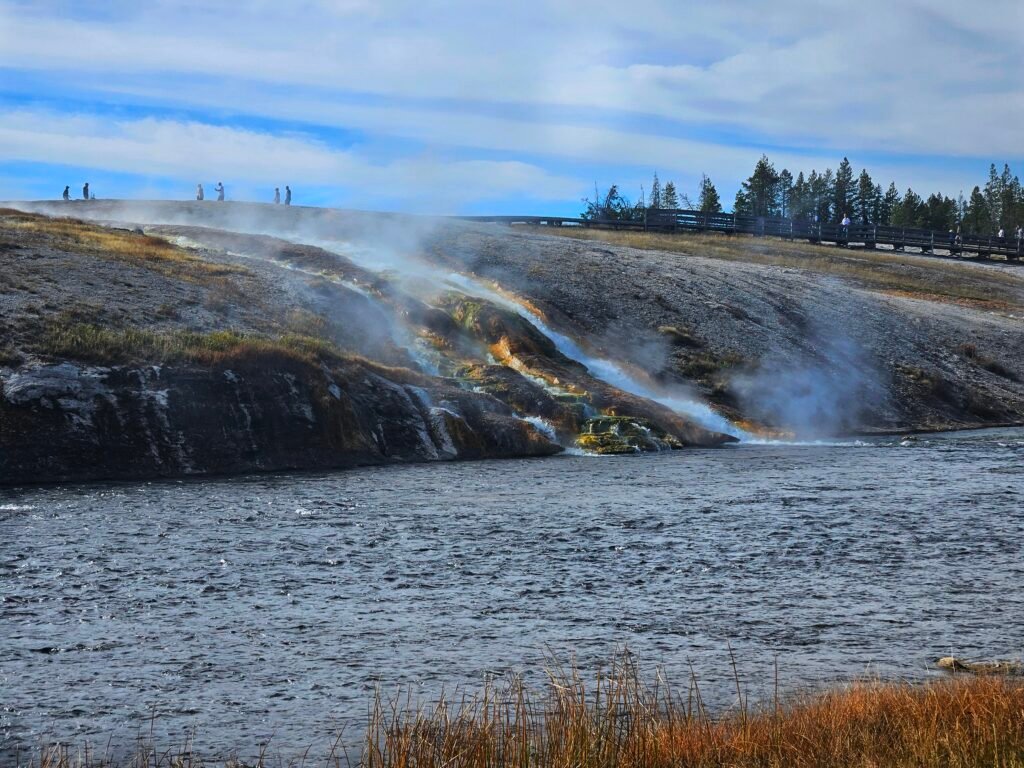 Midway Geyser Basin dumping into the Firehole River.