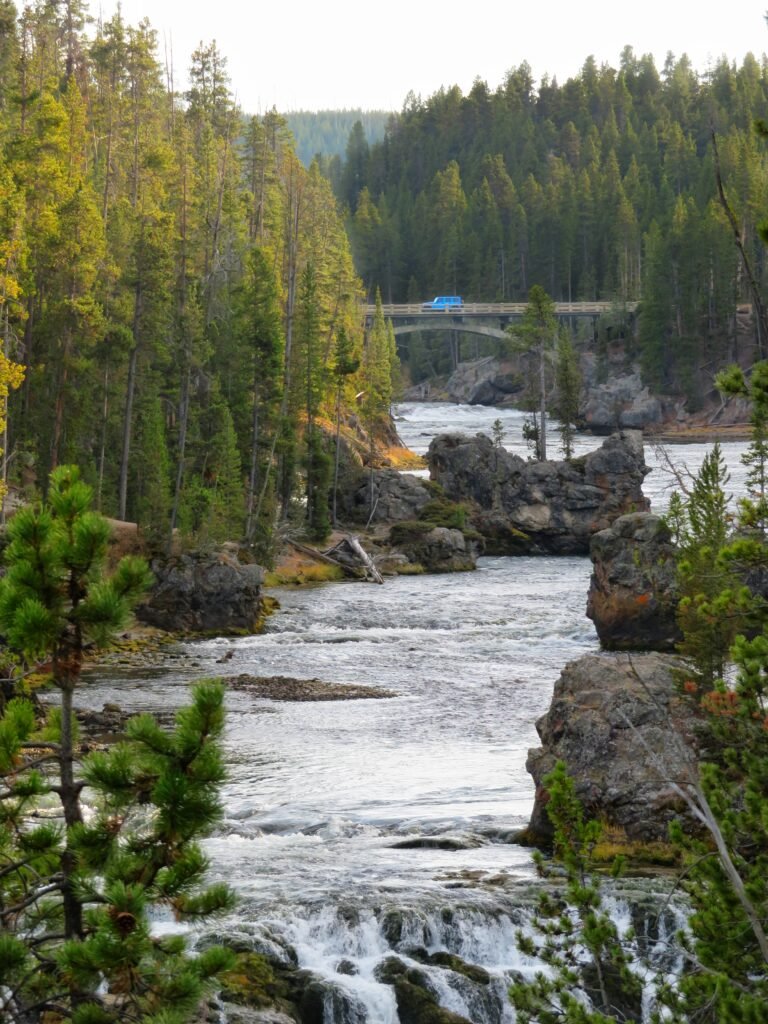 Car driving on a bridge over the Yellowstone River. 
